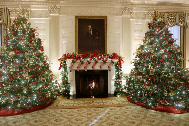 Christmas trees in the State Dining Room are decorated with snapshots of U.S. presidents and their families.