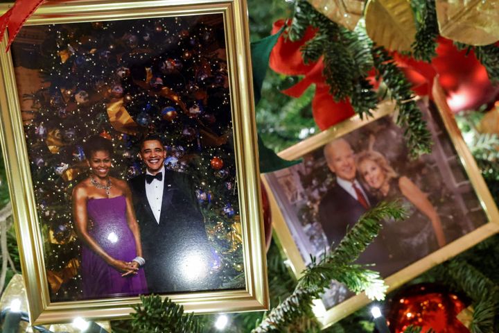 Photos of the Obamas and Bidens can be seen in ornaments hung from Christmas trees in the State Dining Room.