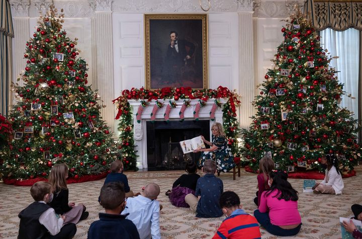 Biden reads to students from Malcolm Elementary School during the unveiling of the holiday decorations Monday.