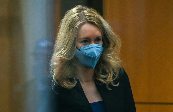 Former Theranos founder and CEO Elizabeth Holmes reviews security after arriving in court at the Robert F. Peckham Federal Building on November 22, 2021 in San Jose, California.