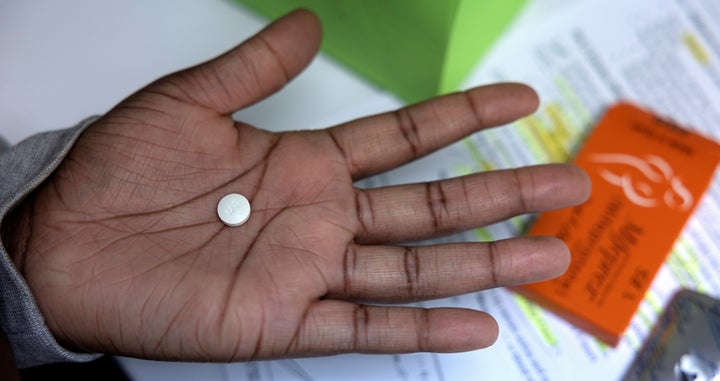 A patient holds abortion-inducing medication at Houston Women's Reproductive Services, Oct. 1.