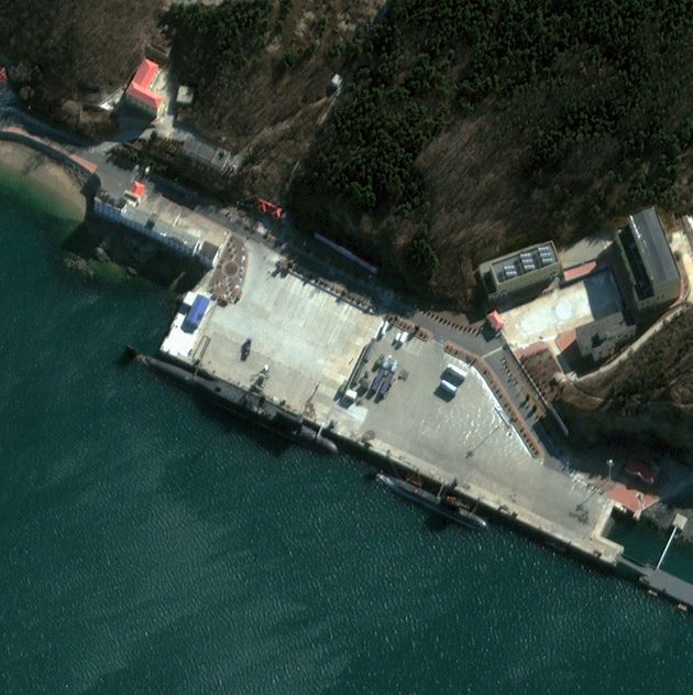 XIAOPINGDAO NAVAL BASE, CHINA-JANUARY 17, 2013: Xiaopingdao Naval Base, also referred to as the 62nd Submarine Training Base, is located on the Yellow Sea just outside of Dalian in Liaoning Province, 450 kilometers east-southeast of Beijing, China. The base is operated by the Chinese People’s Liberation Army Navy (PLAN) North Sea Fleet and is believed be used to prepare submarines for ballistic missile testing. This January 17, 2013, satellite image shows one Type 094 Jin Class (SSBN) submarine, one possible Qing Class (SSB) submarine and two Type 041 Yuan Class (SSK) submarines at the base. (Photo DigitalGlobe via Getty Images via Getty Images)