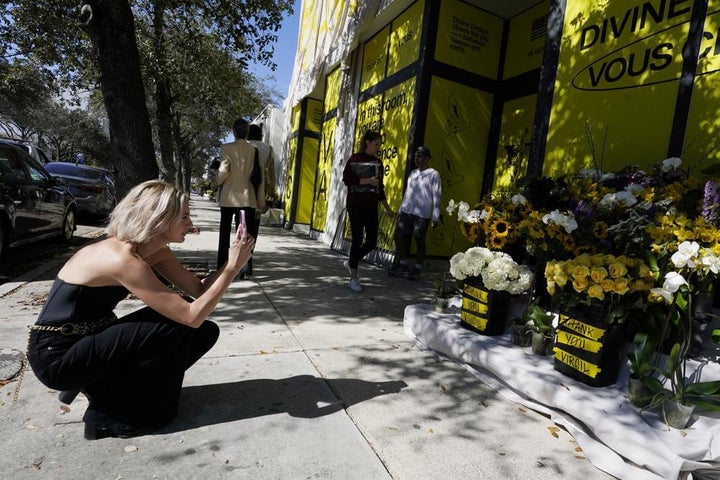 Flowers are left in memory of Virgil Abloh, Louis Vuitton's first Black artistic director, at a church in Miami's Design District, Tuesday, Nov. 30, 2021, in Miami. Abloh, a leading designer whose groundbreaking fusions of streetwear and high couture made him one of the most celebrated tastemakers in fashion and beyond, died of cancer. He was 41.