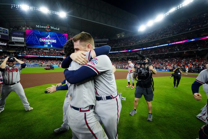 Freddy Freeman and Dansby Swanson hug to celebrate the Atlanta Braves' World Championship win.