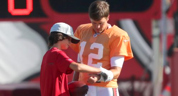 Tom Brady and his son, Jack, during training camp in August.
