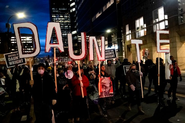 Demonstrators march outside the Hennepin County Government Center on November 30, 2021 in Minneapolis, Minnesota.