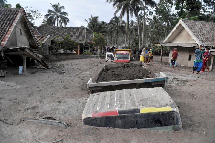 Trucks covered by volcanic ash which is spewed out of Mount Semeru are seen in Sumber Wuluh Village, Lumajang, East Java province, Indonesia December 5, 2021, in this photo taken by Antara Foto/Zabur Karuru via REUTERS. ATTENTION EDITORS - THIS IMAGE HAS BEEN SUPPLIED BY A THIRD PARTY. MANDATORY CREDIT. INDONESIA OUT. NO COMMERCIAL OR EDITORIAL SALES IN INDONESIA. TPX IMAGES OF THE DAY