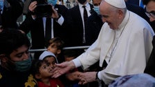  Pope Comforts Migrants At Lesbos Refugee Camp While Urging Action