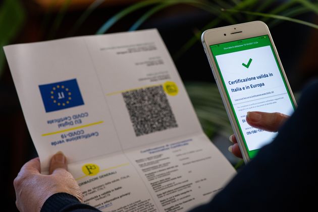 A worker checking green pass certificate in L'Aquila, Italy, on October 15, 2021. On October 15 green...
