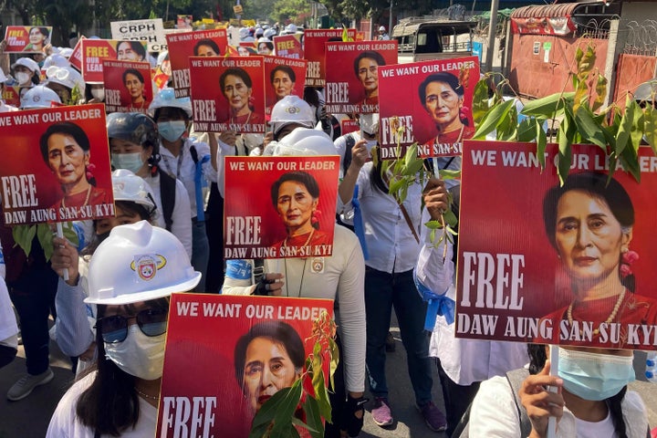 Protesters hold portraits of deposed Myanmar leader Aung San Suu Kyi during an anti-coup demonstration in Mandalay, Myanmar on March 5, 2021.