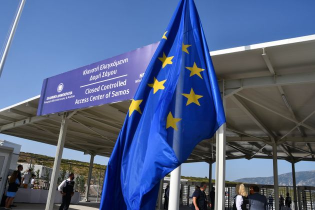 A view of the entrance of the new multi-purpose reception and identification migrant centre which was constructed near Vathy town, on the eastern Aegean island of Samos, Greece, Saturday, Sept. 18, 2021. The centre constructed following a 121 million euros agreement between the European Commission and the Greek Ministry of Migration and Asylum, an amount granted to Greece for the construction of 3 reception centres on the islands of Samos, Kos, and Leros. (AP Photo/Michael Svarnias)