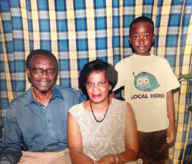 Lewis Semakula in Zimbabwe with his grandparents.