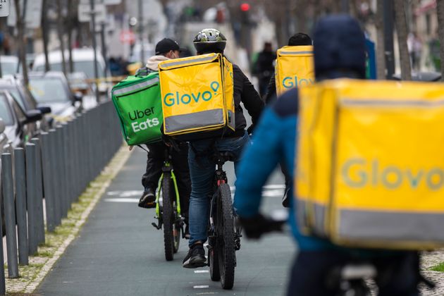 LISBON, PORTUGAL - 2021/02/05: Uber Eats and Glovo couriers are seen riding their bicycles through a bicycle lane in Lisbon.
The pandemic has triggered a large increase in the number of couriers working in the food delivery service industry. In the center of Lisbon, many people choose to make deliveries on bicycles and electric scooters taking advantage of the network of bicycle lanes. (Photo by Hugo Amaral/SOPA Images/LightRocket via Getty Images)