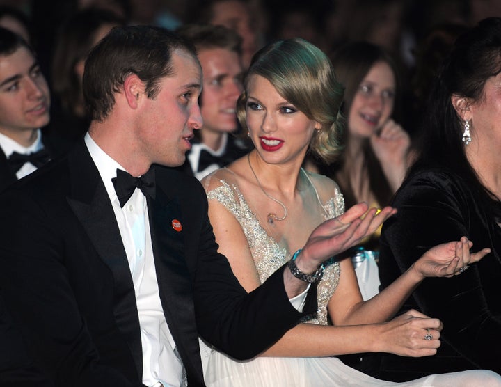 Prince William, Duke of Cambridge and Taylor Swift attend the Winter Whites Gala in Aid of Centrepoint on Nov. 26, 2013, in London, England.