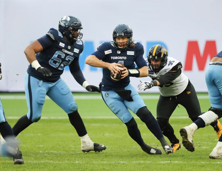 Toronto Argonauts quarterback McLeod Bethel-Thompson scrambles in traffic during the CFL's Eastern Final, which was marred by a postgame incident.