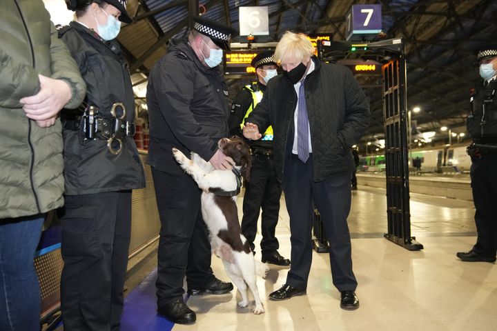 Boris Johnson talks to British Transport Police officers and police dog Ozzy at Liverpool Lime Street station as part of 'Operation Toxic' to infiltrate county lines drug dealings.