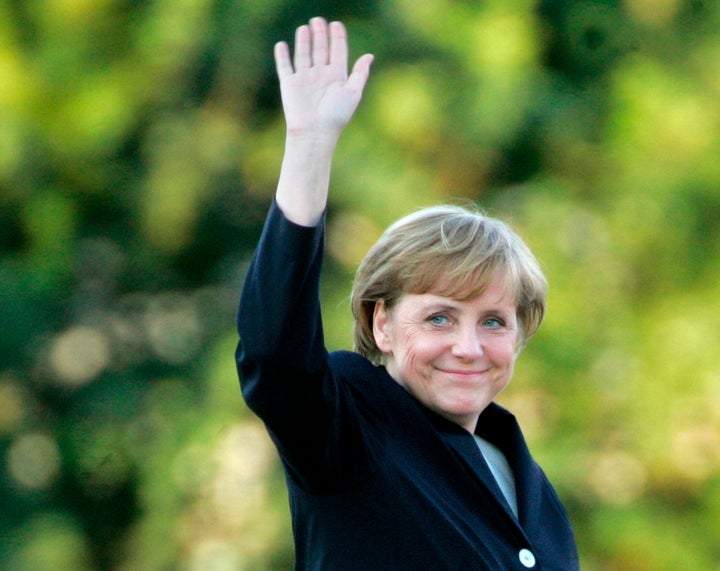 Angela Merkel arrives for a television debate with Chancellor Gerhard Schroeder at a television studio in Berlin, Sept. 4, 2005. Her designated successor Olaf Scholz is expected to take office on Dec. 8, 2021. 