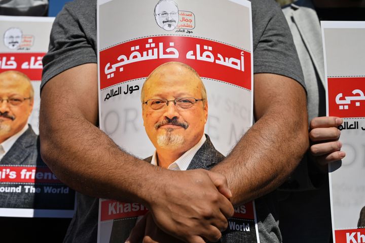 Friends of murdered Saudi journalist Jamal Khashoggi hold posters bearing his picture as they attend an event marking the second-year anniversary of his assassination in front of Saudi Arabia Istanbul Consulate in 2020.