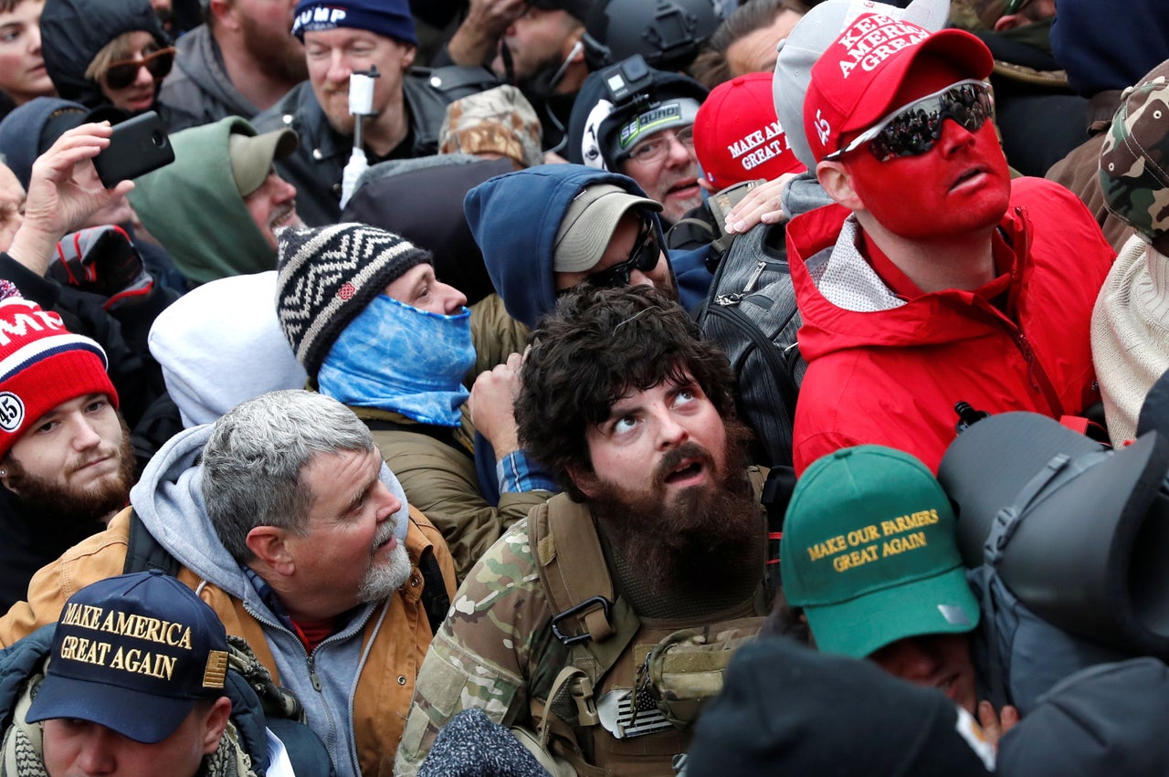 The face-painted man known as "Rally Runner" stands with the pro-Trump crowd at the U.S. Capitol on Jan. 6.