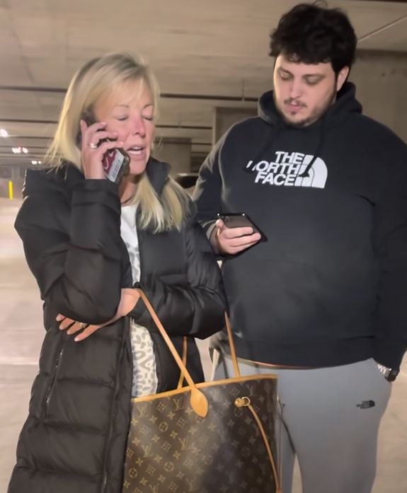 Bitsy Brennan calls the police with her son, Edward Brennan, as captured on cell phone video recorded by Johnny Martinez. 