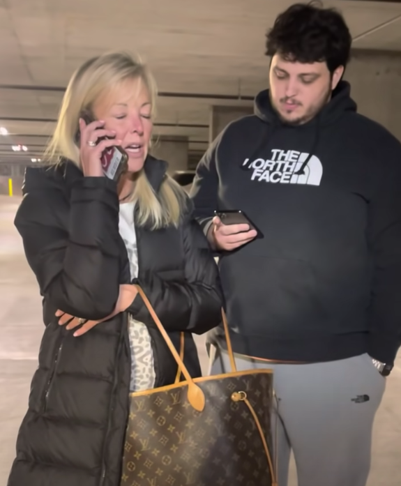 Bitsy Brennan calls the police with her son, Edward Brennan, as captured on cell phone video recorded by Johnny Martinez. 