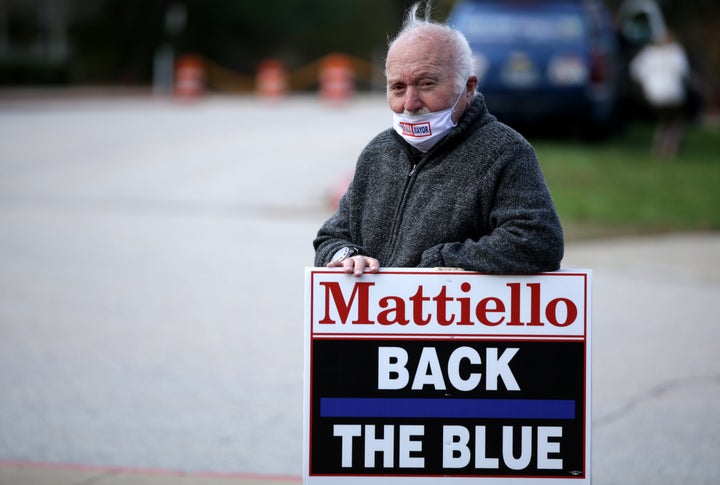 A supporter for Democratic House Speaker Nicholas Mattiello, a conservative Democrat whose 2020 loss shifted the state's politics to the left.