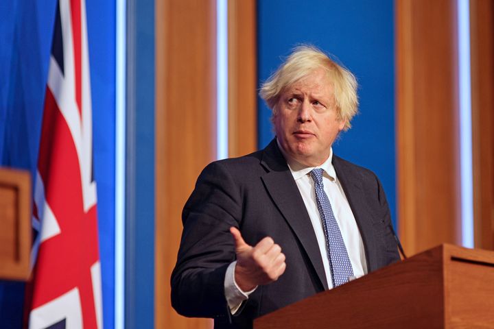 Boris Johnson speaking at a press conference in Downing Street after ministers met to consider imposing new restrictions in response to rising cases and the spread of the Omicron variant.