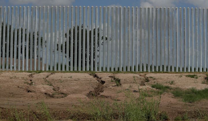 Erosion damage caused by Hurricane Hanna is seen near portions of a privately funded border fence along the Rio Grande near Mission, Texas, in July 2020.