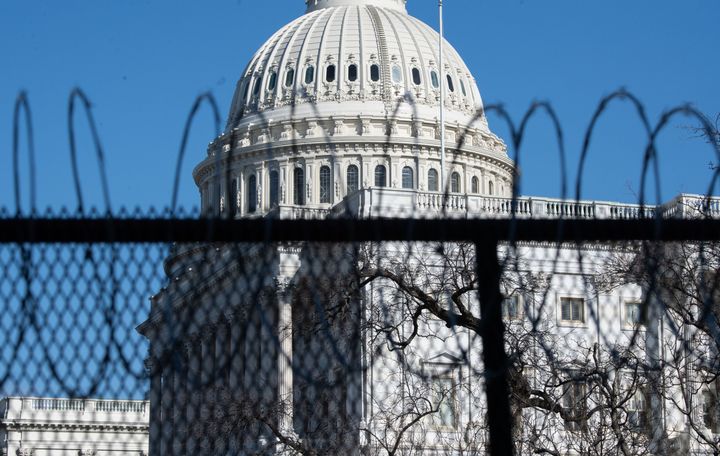 A barbed-wire obstruction   surrounds the U.S. Capitol connected  Jan. 14, a week aft  a assemblage  of Donald Trump supporters attacked the gathering  connected  Jan. 6.