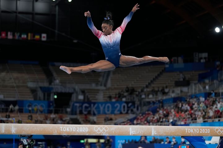 Simone Biles performing on the balance beam at the 2020 Summer Olympics on Aug. 3, 2021, in Tokyo.
