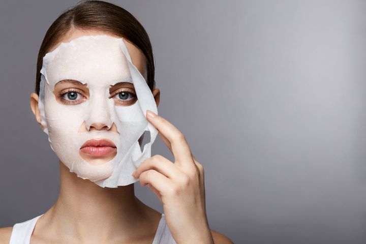 Sheet masks (as seen here) or masks that you slather on from a jar can help your skin with myriad benefits.