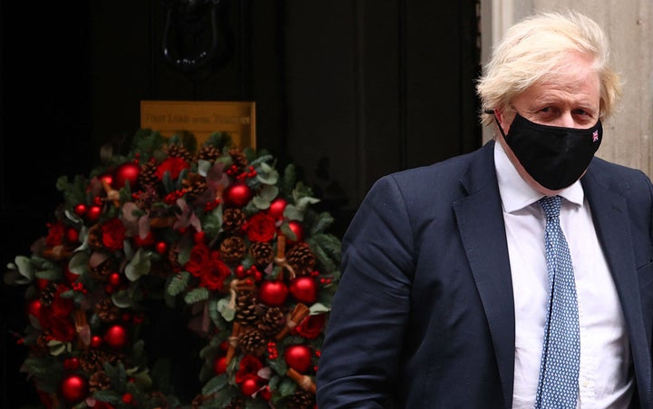 Johnson leaves from 10 Downing Street in central London on December 8, 2021