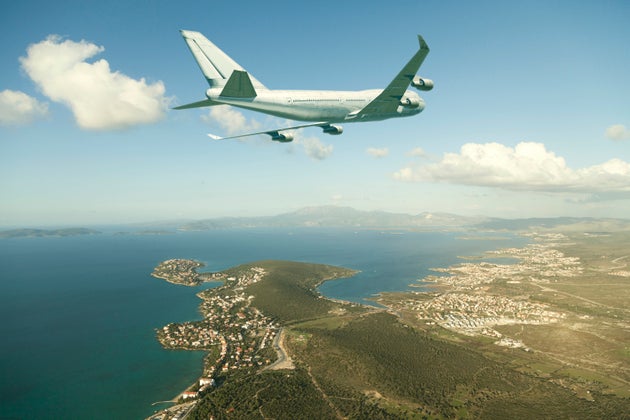 airplane approaching a coast city