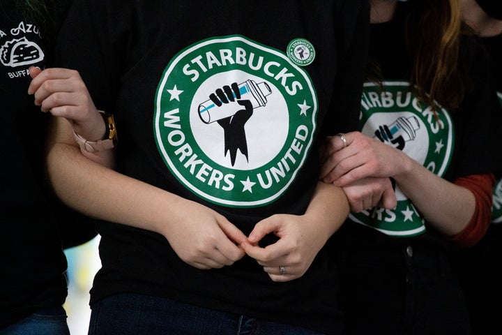 Starbucks employees and supporters react as votes are read during a union election watch party on Dec. 9, 2021, in Buffalo, New York.