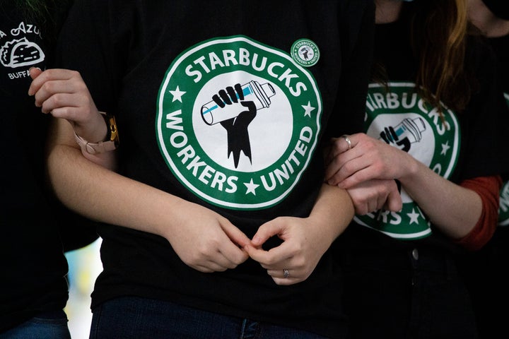 Starbucks employees and supporters react as votes are read during a union-election watch party on Thursday, Dec. 9, 2021, in Buffalo, N.Y.