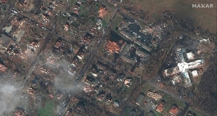 This Saturday, Dec. 11, 2021, satellite photo provided by Maxar shows homes and buildings in Mayfield, Ky., after a tornado caused heavy damage in the area. (Satellite image ©2021 Maxar Technologies via AP)