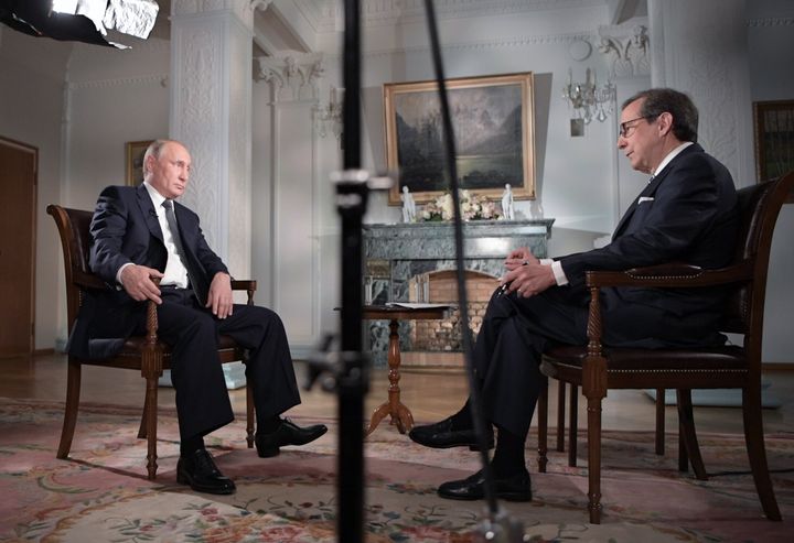 Russia's President Vladimir Putin gives an interview to Fox News Channel anchor Chris Wallace in 2018. Wallace moderated two general-election presidential debates and interviewed several U.S. presidents and world leaders while with Fox News.