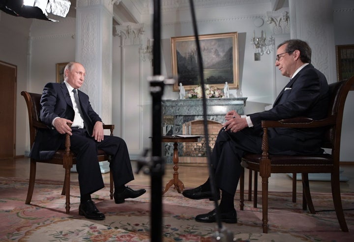 Russia's President Vladimir Putin gives an interview to Fox News Channel anchor Chris Wallace in 2018. Wallace moderated two general-election presidential debates and interviewed several U.S. presidents and world leaders while with Fox News.