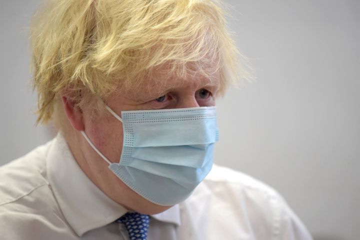 Johnson under pressure after the Mirror published images of him taking part in a virtual quiz while sat next to two colleagues on December 15 2020.