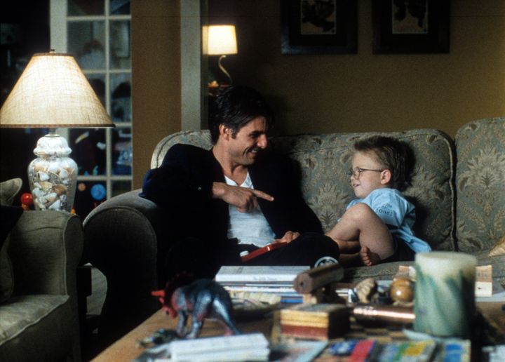 Tom Cruise points to Jonathan Lipnicki in a scene from the film "Jerry Maguire."