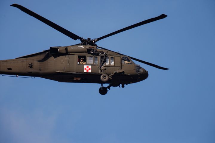 A Kentucky National Guard helicopter surveys the tornado damage near Mayfield Consumer Products on Dec. 11 in Mayfield, Kentucky.
