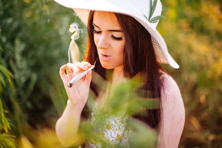 Young couple enjoying in marijuana field