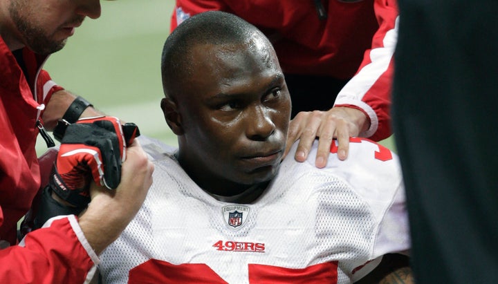 In this Dec. 26, 2010, file photo, San Francisco 49ers cornerback Phillip Adams is attended to after injuring his left leg during a game against the St. Louis Rams, in St. Louis.