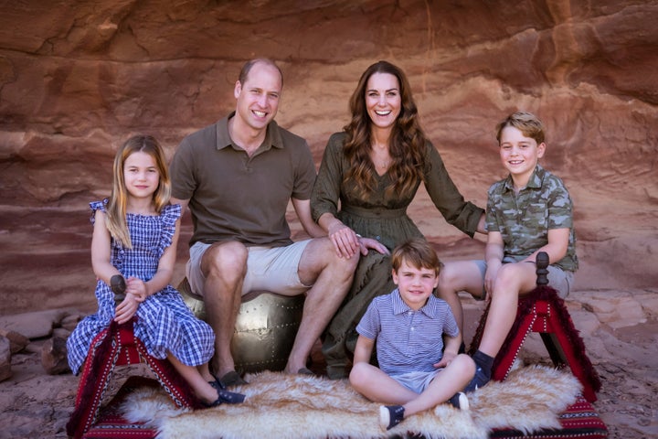 The duke and duchess of cambridge pose with their children prince george, princess charlotte and prince louis during a visit to jordan.