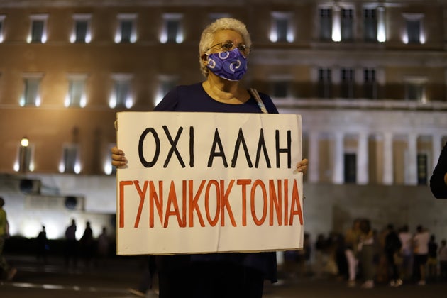 ATHENS, ATTIKA, GREECE - 2021/09/25: Women rights activist holding placard protest against feminicide. (Photo by George Panagakis/Pacific Press/LightRocket via Getty Images)