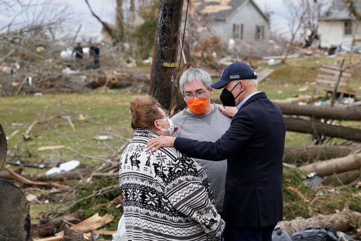 President Joe Biden speaks to tornado survivors as he surveys storm damage in Dawson Springs, Kentucky on Wednesday.