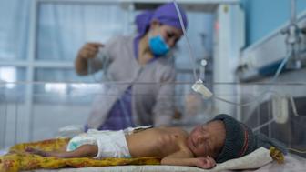 A nurse takes care of a baby in the neonatal intensive care unit of Malalai Maternity hospital in Kabul, Afghanistan.&nbsp;