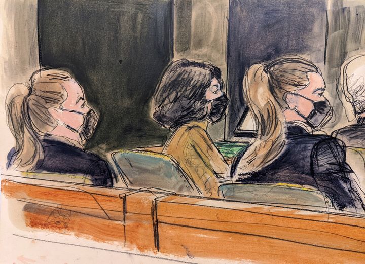 Ghislaine Maxwell, center, is seated in court at a defense table between two U.S. Marshals in the foreground. (AP Photo/Elizabeth Williams)