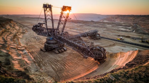 Aerial view of a back lit Bucket Wheel Excavators working in a lignite surface mine at