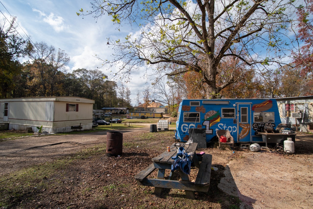 Blackmon Hole, a neighborhood of trailers, sits next to the Drax Biomass production facility.